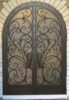 EL5000 MCD arched double wrought iron door with flowing scroll grille and insulated glass panels