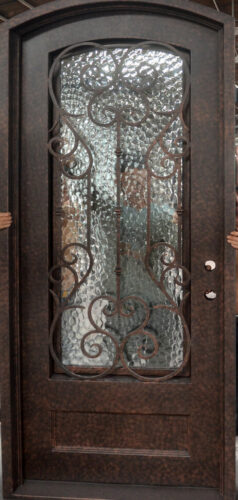 EL997 MCD single wrought iron door with decorative scroll grille and hammered insulated glass panel