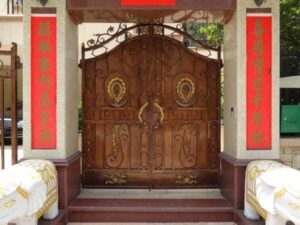 Ornamental double wrought iron gate with decorative scrollwork and medallion accents G102 MCD