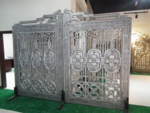 Decorative wrought iron gate with regal medallion detailing and geometric iron patterns G105 MCD