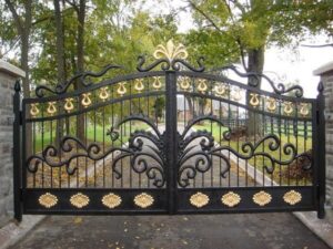 Decorative wrought iron gate with gold accents and ornate scrollwork detailing G123 MCD