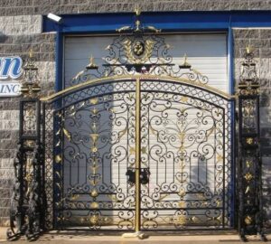 Ornate wrought iron gate with royal crest and decorative gold detailing G124 MCD