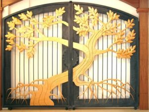 Artistic wrought iron gate with decorative golden tree and branch detailing G128 MCD