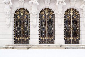 Ornate wrought iron gate with Baroque scrollwork and decorative gold detailing G133 MCD