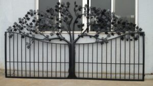 Artistic wrought iron gate with handcrafted tree silhouette and decorative branch detailing G117 MCD