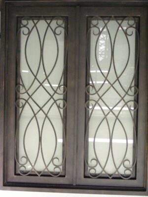 Contemporary wrought iron door EL1161 MCD with lattice scroll design and frosted glass, handcrafted for modern elegance.