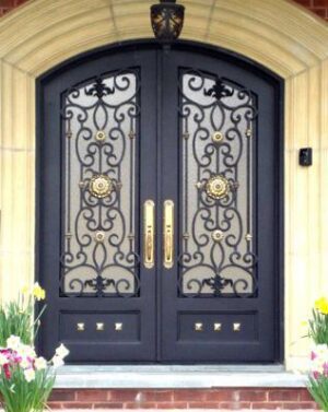 Double wrought iron door EL1109 MCD with bronze patina finish and scrollwork, hand-forged for luxury appeal.