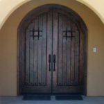 Exterior wood doors with wrought iron designs