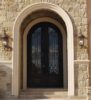 Double arched wrought iron door EL1074 MCD with scroll panels and glass, handcrafted for elegance and durability.