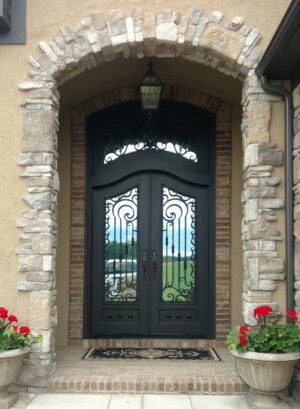 EL1059 MCD Exquisite hand-crafted wrought iron door with scroll panels, combining durability, elegance, and lasting security.