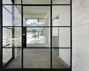 Contemporary wrought iron door EL1131 MCD with glass grid panels, hand-forged for modern elegance and strength.