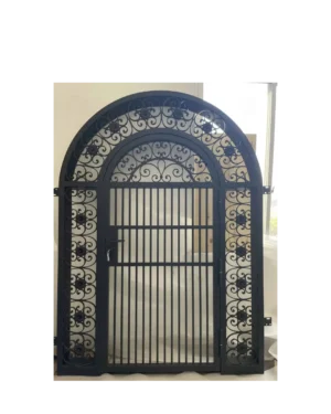 Arched wrought iron gate with decorative scrollwork and vertical security bars G103 MCD