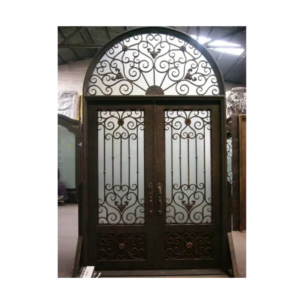 Double wrought iron door EL1005 MCD with ornate scrollwork and arched transom, handcrafted for elegance and strength.