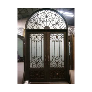 Double wrought iron door EL1005 MCD with ornate scrollwork and arched transom, handcrafted for elegance and strength.