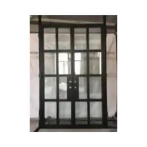 Wrought iron door EL1022 MCD with modern grid-style iron frame and glass panels, handcrafted for strength and contemporary style.