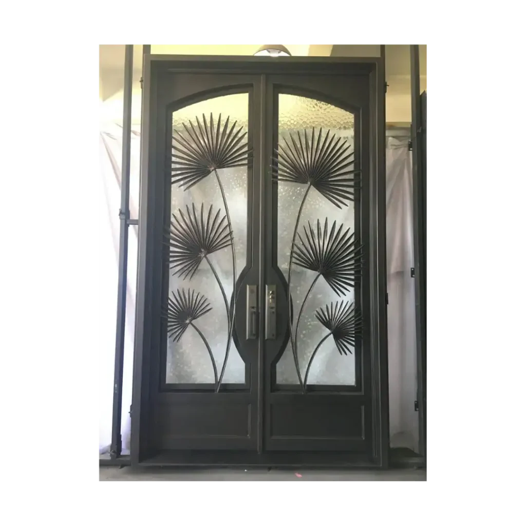 The EL1030 MCD double wrought iron entry door features artistic palm leaf motifs over textured glass, handcrafted from 12-gauge wrought iron. Built for strength, elegance, and artistry, it includes operable glass panels for ventilation and cleaning. A unique design perfect for luxury homes and estates seeking a bold, nature-inspired entryway.