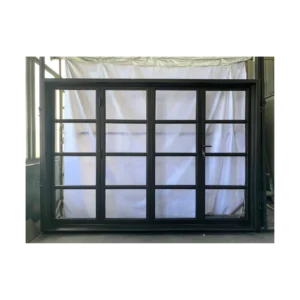 Contemporary pivot wrought iron door EL1129 MCD with glass grid panels, hand-forged for modern elegance.