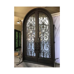 Ornate double arched wrought iron door EL1132 MCD with scrollwork and eyebrow arch, hand-forged for artistry and strength.