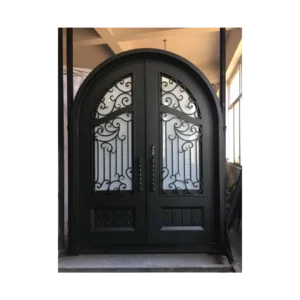 Double arched wrought iron door EL1134 MCD with decorative transom and scrolls, hand-forged for luxury strength.