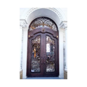 Ornate arched wrought iron door EL1135 MCD with hand-forged scrollwork, designed for strength and artistry.