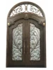 Ornate Arched Transom Custom Wrought Iron Door EL1046 MCD with handcrafted scrollwork and insulated glass.