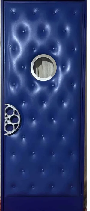 Blue tufted leather home theater door HT3027 MCD featuring a round porthole window and decorative film reel handle